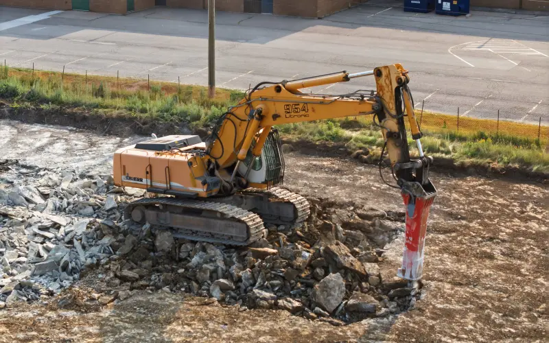 Close view of construction equipment during visible site-preparation work at South Coast on July 23, 2026