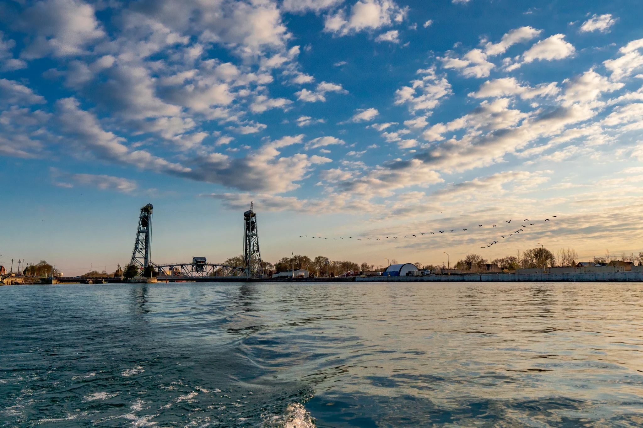 Port Colborne lift bridge across the water at sunset